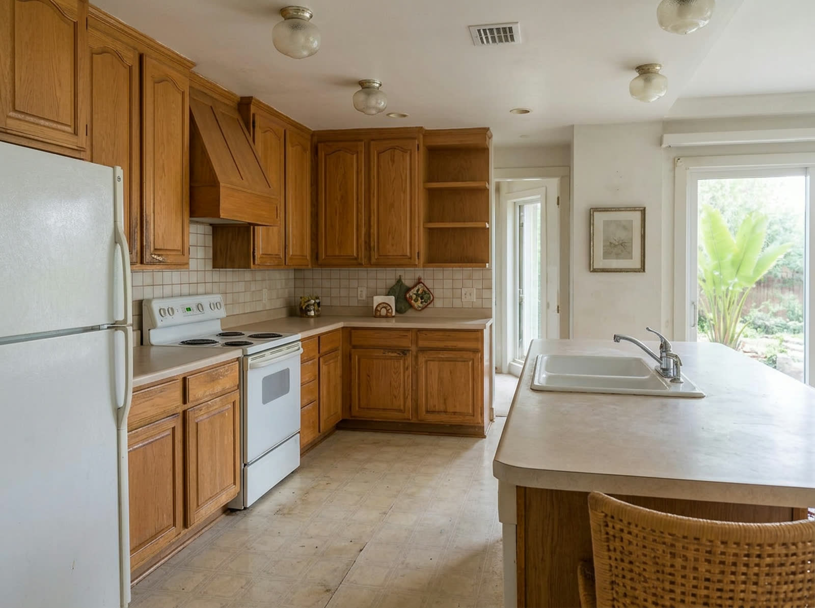Dated kitchen before remodeling, photographed from the reference camera position